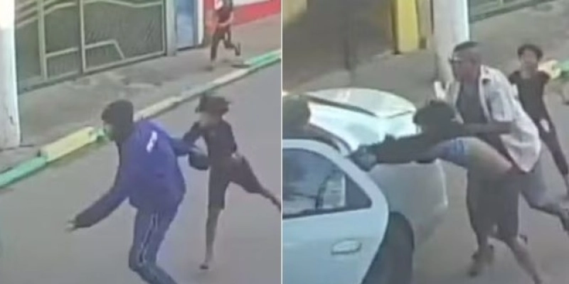 Homem de azul tenta sequestrar criança e morador impede crime - Reprodução